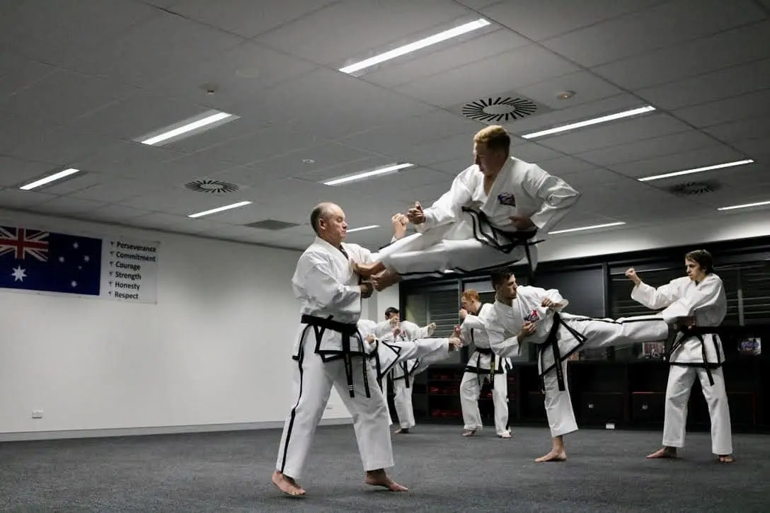 Chief Instructor Alex Benson performing a twin flying side kick into Senior Instructor Steven Mills in Canberra.